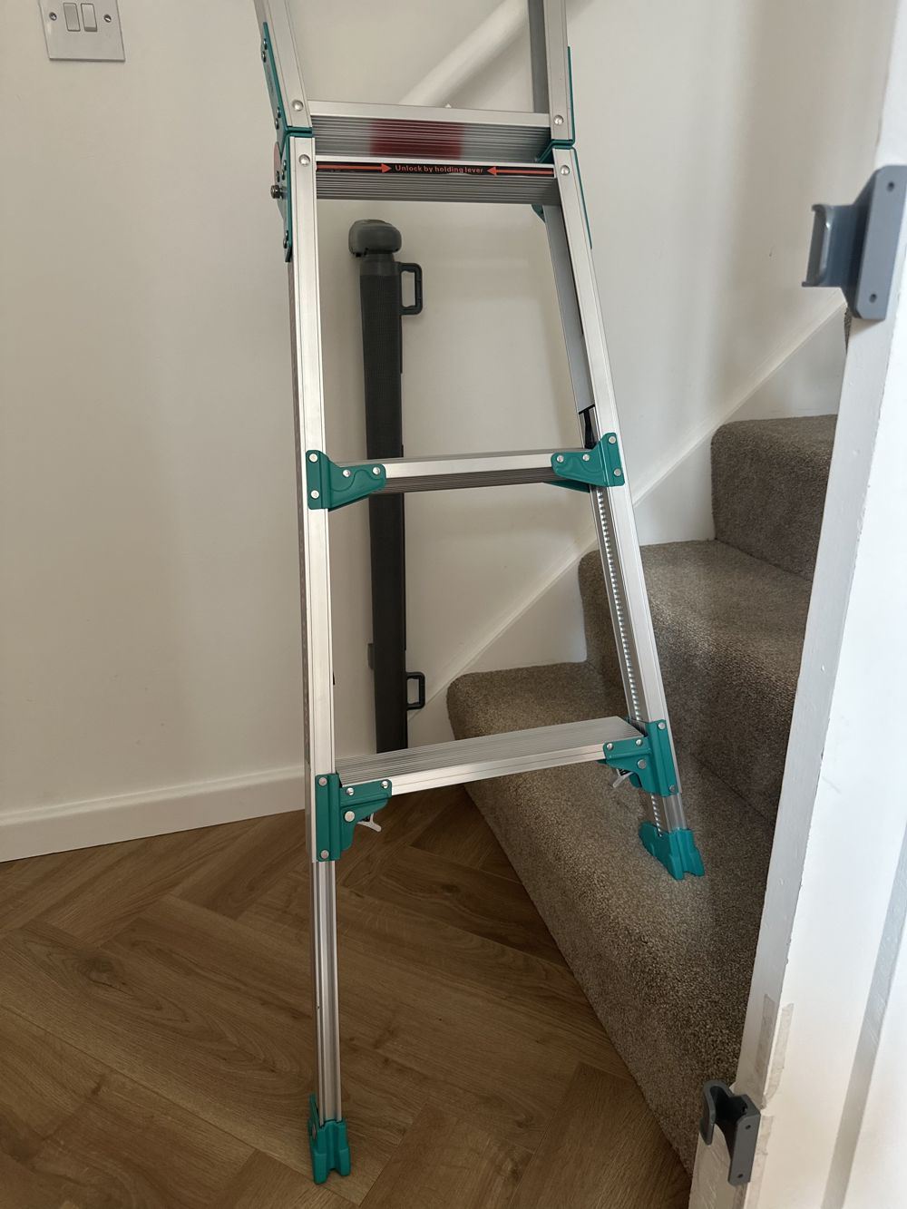 Level Step Pro ladder on stairs, angled leg detail