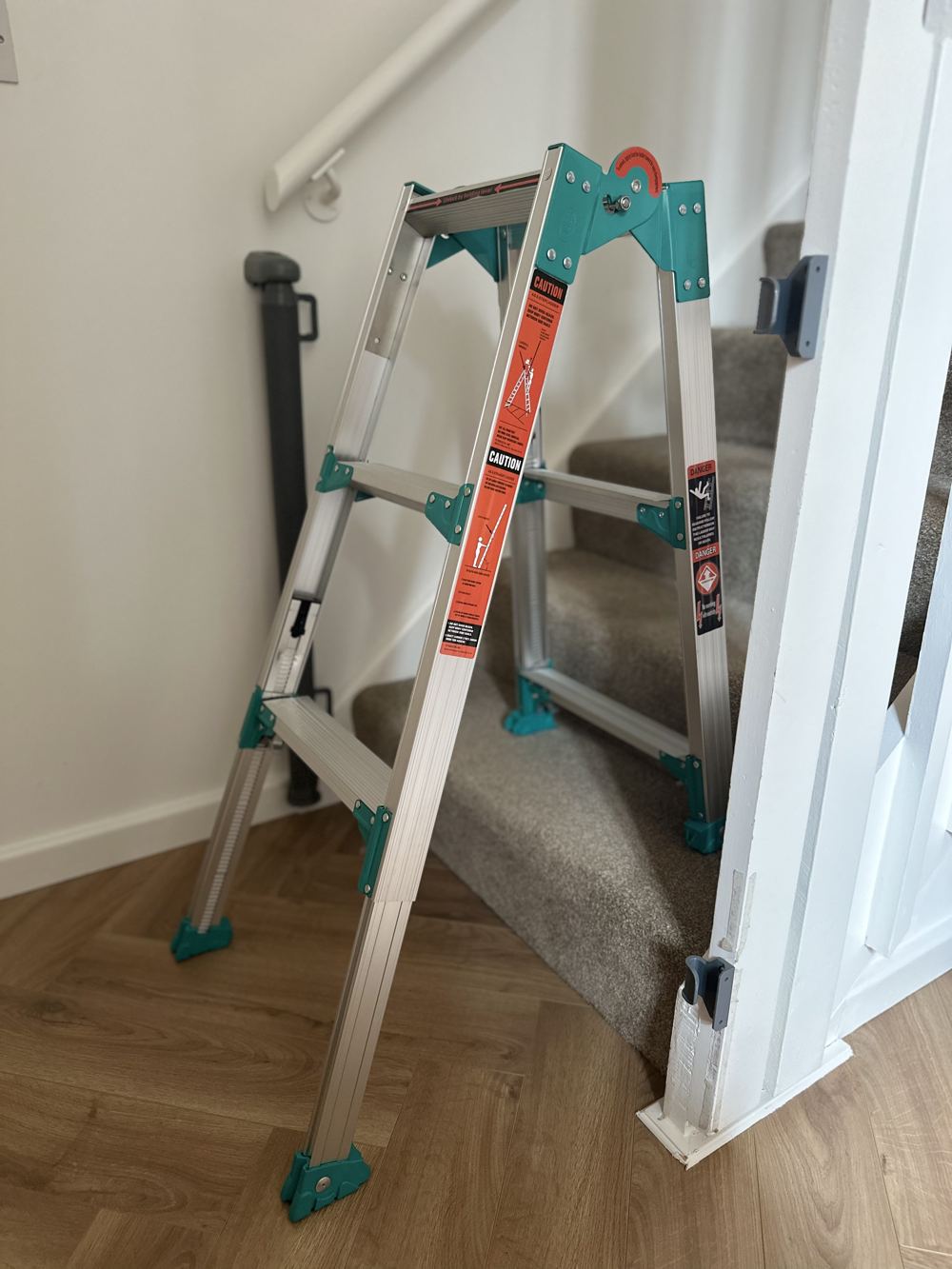 Level Step Pro adjustable ladder set up on a staircase, legs extended independently